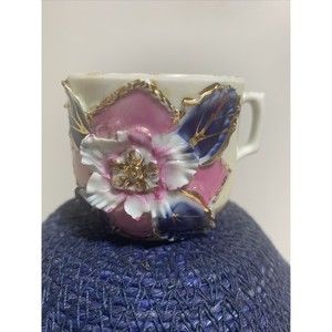 VINTAGE GERMAN TEACUP with GOLD trim WITH RAISED FLOWER MOLDED